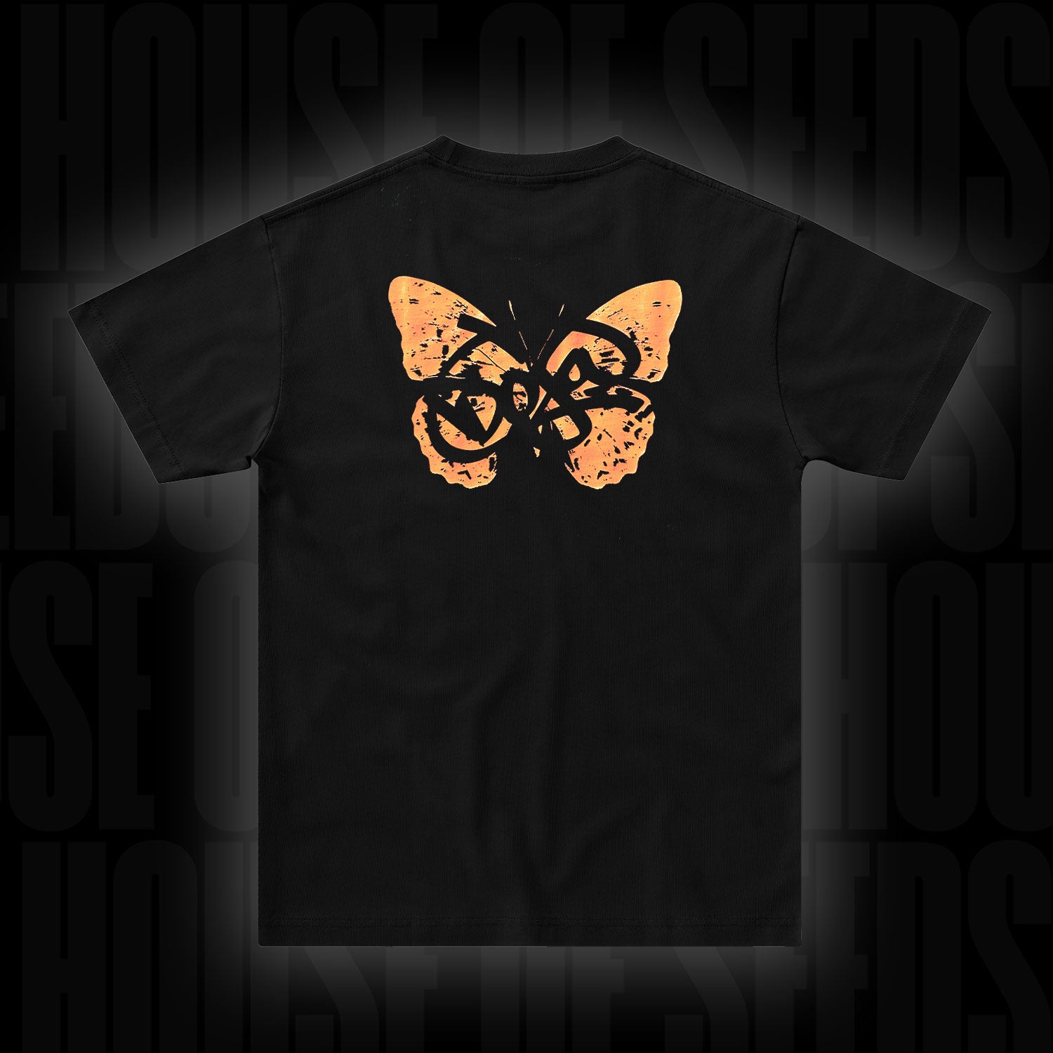 Doja T-Shirt Butterfly Orange von Doja mit einem orangefarbenen Schmetterling und Graffiti-Text auf der Rückseite.